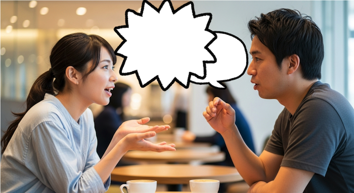 男性が喋ろうとしているのを遮っている女性の画像
